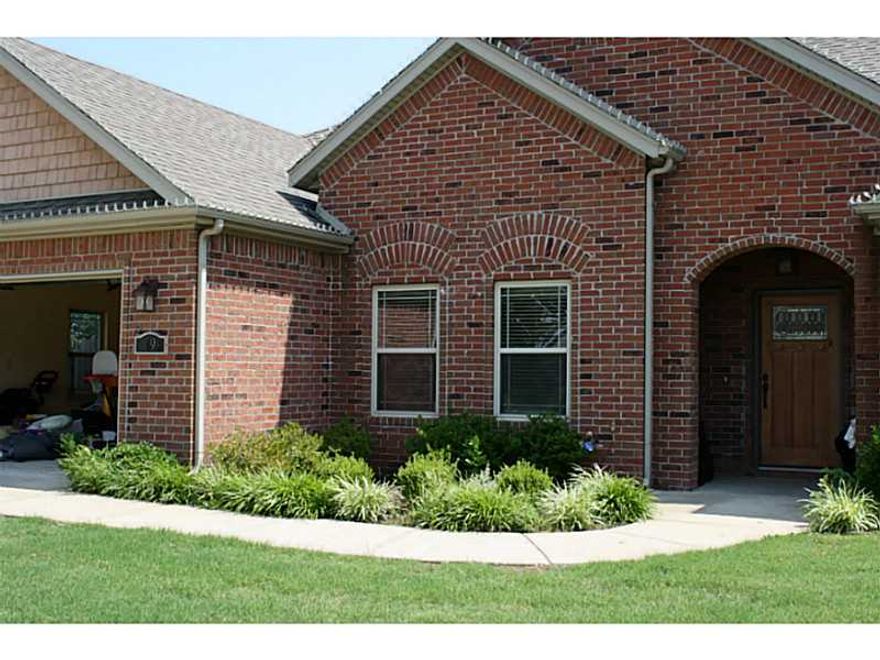 Lovely 4 bdrm, 3 full bath brick home adjacent to Razorback golf course. Gorgeous setting! Hardwood floors in LR, Dining rm, foyer, hall & 2 bdrms. Lrg kitchen w/ granite cntr tops, island & gas range. One bdrm could be Mother-in-law ste. Iron/wood fence.