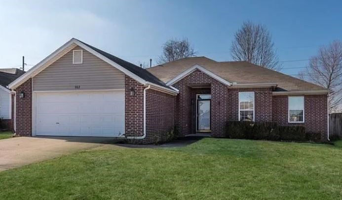 Some pictures in this listing include virtual staging. Great Bentonville location! This well-maintained 3-bedroom, 2-bath home features an open layout with a cozy gas log fireplace, a versatile bonus room perfect for a home office, and a sunlit eat-in kitchen that flows into a heated and cooled sunroom. Includes stainless steel appliances. Enjoy a fully fenced backyard with a spacious covered patio ideal for relaxing or entertaining. The home also offers tile and carpet flooring throughout and an attached 2-car garage. Located just minutes from top-rated schools, Downtown Bentonville, and extensive walking and biking trails, this property blends comfort, convenience, and potential. Pets negotiable.