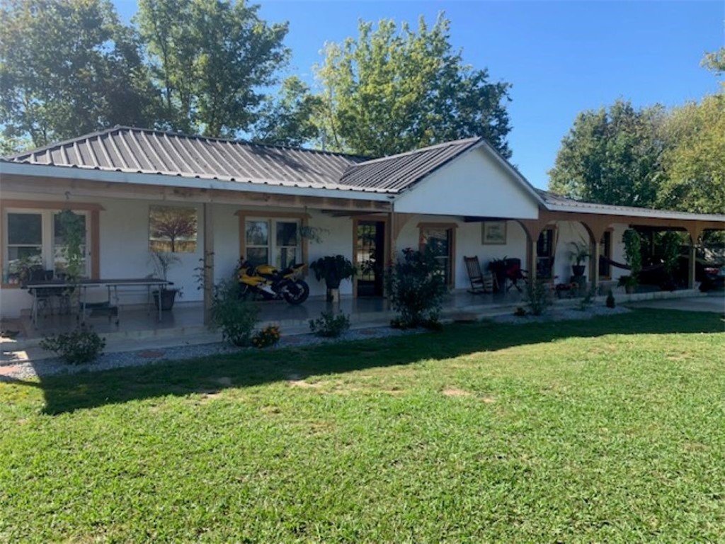 Relax with the grazing cattle on this 10-acre farming property, showcased by a beautiful 4-bedroom 2 bath renovated home, boasting 2091 sq ft.  An oversized primary bedroom, rear enclosed patio for additional relaxation.  A huge workshop!  The additional home in front of the property is included.  Sold "AS IS"