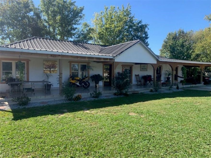 Relax with the grazing cattle on this 10-acre farming property, showcased by a beautiful 4-bedroom 2 bath renovated home, boasting 2091 sq ft.  An oversized primary bedroom, rear enclosed patio for additional relaxation.  A huge workshop!  The additional home in front of the property is included.  Sold "AS IS"