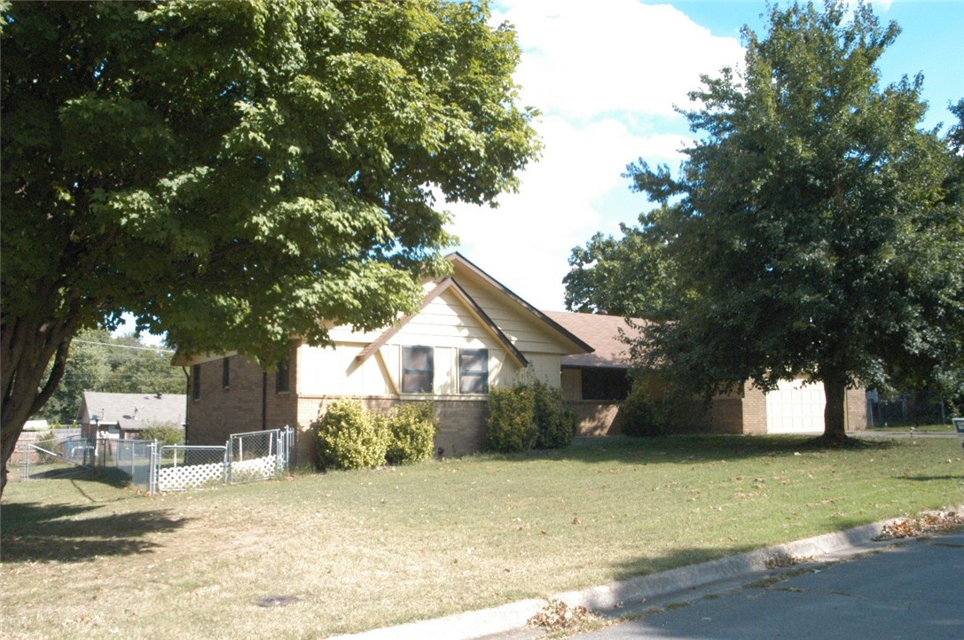 Great house, Great location and Great price. Walk to grade school, middle school and high school from the quite neighborhood. Large bedrooms and hallways. Living room and dining room. Den with big stone fireplace, kitchen has fantastic cabinets and great,pantry. Handicap accessible, covered deck leads to backyard that is landscaped. Big trees in front and back.