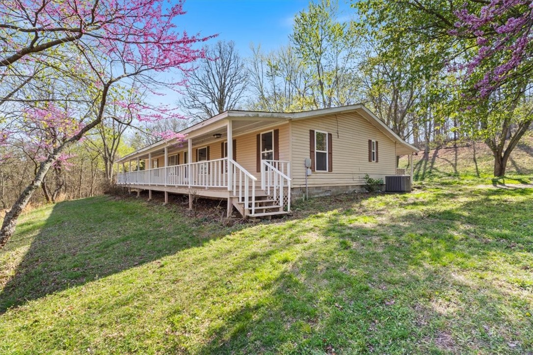 Nice, manufactured home built in 1995 that sits on 18.62 wooded acres. Three bedrooms, two bathrooms, large living area and a detached two car garage. Home has a wraparound porch, the perfect place to sit peacefully outside and enjoy the scenery. There is a partial fence on the boundary line of land. Lots of potential for this property!