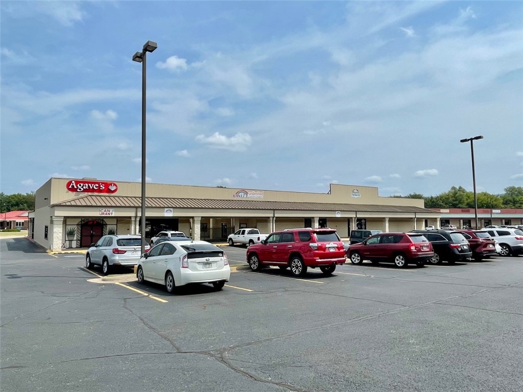 Fully leased commercial building just off of Hwy 62 in the middle of Farmington. Currently there are multiple tenants in the building with over 21000 square feet. Restaurant, church, a daycare, and retail space occupy the freshly painted building. The nearby McDonald's leases a few of the extra parking spaces for extra employee parking. With 130 parking spots there is plenty of parking for all of the businesses. Zoned C-2.