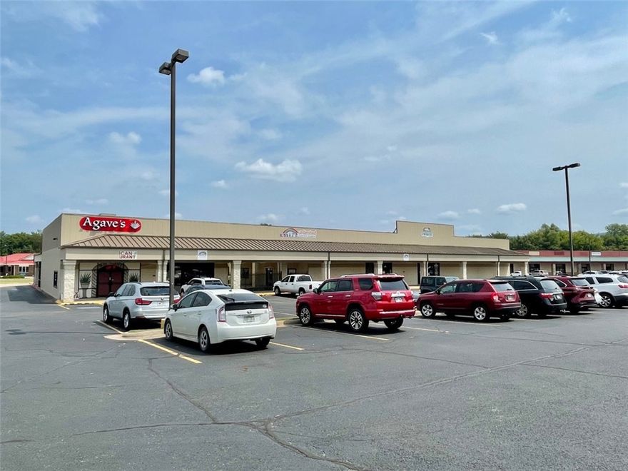 Fully leased commercial building just off of Hwy 62 in the middle of Farmington.  Currently there are multiple tenants in the building with over 21000 square feet.  Restaurant, church, a daycare, and retail space occupy the freshly painted building.  The nearby McDonald's leases a few of the extra parking spaces for extra employee parking.  With 130 parking spots there is plenty of parking for all of the businesses.  Zoned C-2.