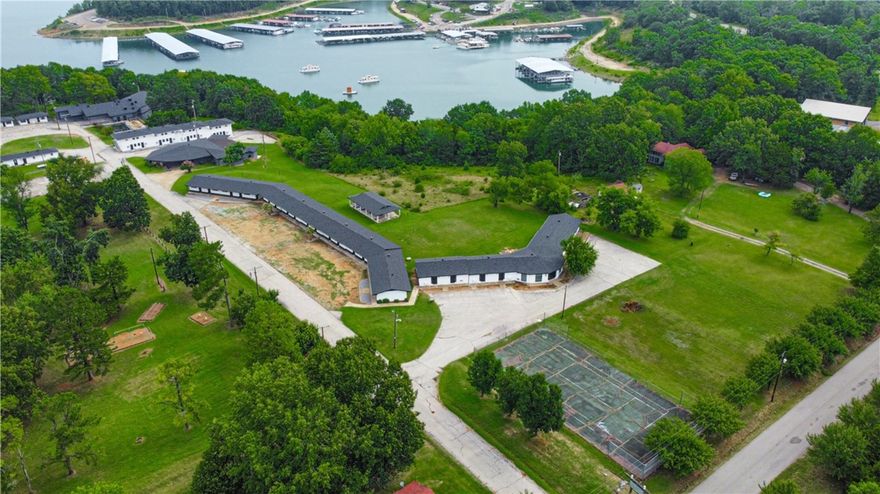 Resort with Restaurant on 9.17 acres m/l joining corp of engineer’s land across from marina at Bull Shoals Lake with over 35,000 sq ft. Tennis court, pavilion, volley ball, playground, shuffleboard, gym w/sauna, 150 seat restaurant with 50 seat bar. Conference room, office with living quarters, event room. 58 units, commercial laundry room with storage. Many rooms adjoin and have shared kitchens. Exterior has all new roofs and new paint inside and out as of 2023. 31 room currently rented.