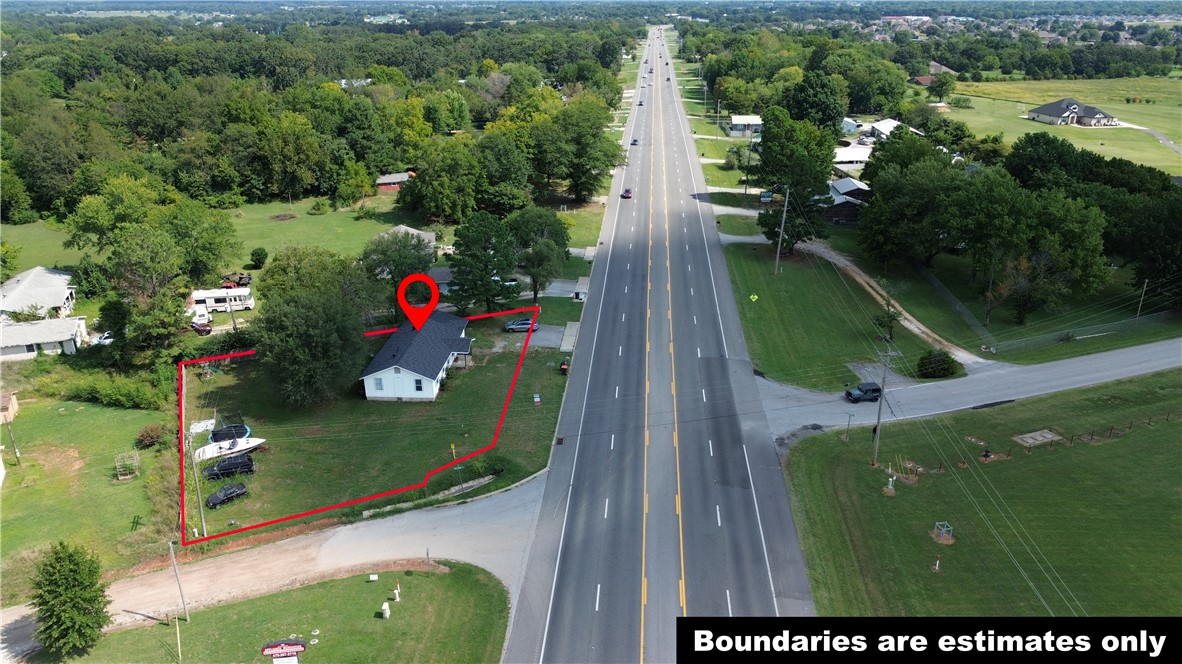 Incredible investment opportunity! This prime corner lot with mixed-use zoning offers endless potential—ideal for a business, residential home, or a combination of both. Located within Prairie Grove city limits, bordering Farmington, this property sits in a rapidly growing area with strong commercial development nearby. If you would like to tour the property please call! Don’t miss your chance to secure a versatile property in a high-demand location! Also listed as MLS#1317553.