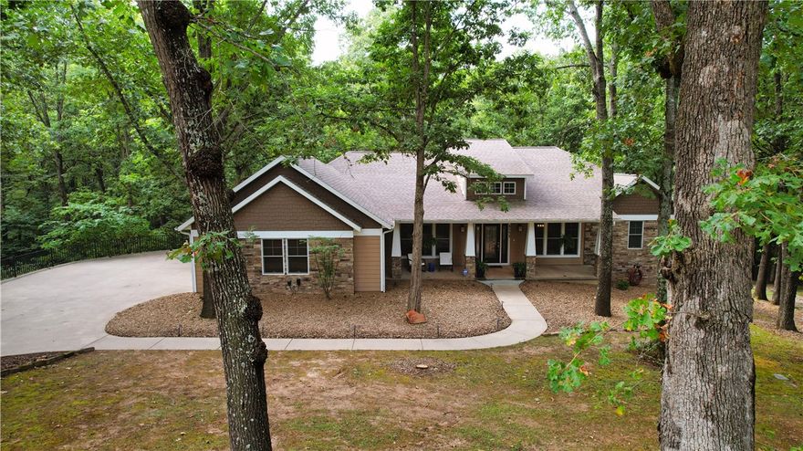 Welcome to your own private retreat just minutes from downtown Bentonville! Nestled on 1.5 wooded acres along sought-after Plentywood Road, this fully remodeled home blends modern comfort with natural beauty. Step inside to an open floor plan filled with natural light, perfect for gathering and entertaining. The floorplan and design offer more storage than you'll ever need, plus a workshop in the basement for projects and hobbies. Outside, enjoy resort-style living with a heated gunite pool and spa, surrounded by mature trees and frequent visits from friendly deer. It's the perfect balance of peace, privacy, and convenience - close to all Bentonville has to offer, yet it feels like you've escaped to your own private resort.