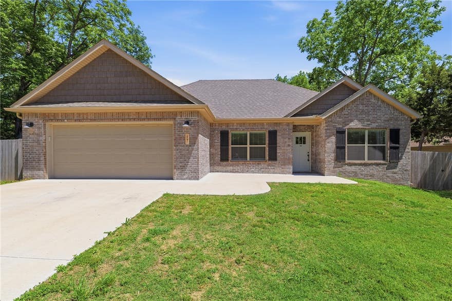 2 year-like new home combines high-end finishes with practical upgrades on a nearly level lot. Nestled on a beautiful cul-de-sac, the property offers both privacy & curb appeal. The split floorplan features 9-foot ceilings & upgraded flooring (No carpet).  The kitchen is equipped with GE Café appliances, including a gas range & refrigerator.  Custom cabinetry and quartz countertops are featured throughout the home. The 4th bedroom has been used as an office space (no closet). The spacious primary suite features dual vanities, a walk-in closet & tile shower. The garage features a 4x6 tornado shelter (EF5 rated).  Situated on an oversized 0.38-acre flat lot, the home also includes a fully fenced backyard and an 8-foot double gate. For extended outdoor living, enjoy the privacy of a large 15x10 covered back deck. Seller is converting septic system to public sewer. Conveniently located with easy access to Highway 71B, residents also enjoy proximity to Bella Vista’s 7 golf courses, 7 private lakes, and trails.