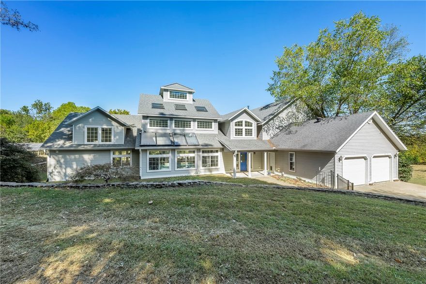 This will be pending a new survey and approval of the split. 4bed, 4bath estate with 15 +/-  acres, 2 Shops, and indoor pool. Just 20 minutes from I49, this home has been designed w/ efficiency and functionality in mind; fully electric w/solar for backup power & reduced expenses. As you step inside, you'll be greeted by high ceilings, hardwood floors, & an abundance of natural light. The open kitchen is perfect for entertaining & features a double oven which will make preparing your holiday feasts a joy. Home is 3543sq ft and an additional 2229sq ft indoor pool room with kitchenette that is fully ventilated, making you feel like you are on vacation without ever leaving home. The saltwater pool is almost maintenance free with geothermal heating &water slide. 2 out-buildings on the property provide ample space for all your toys orhobbies.30x50 shop has pull-through double door & pole barn outside. 30x24 2nd shop. Come make your dreams a reality with this incredible property.