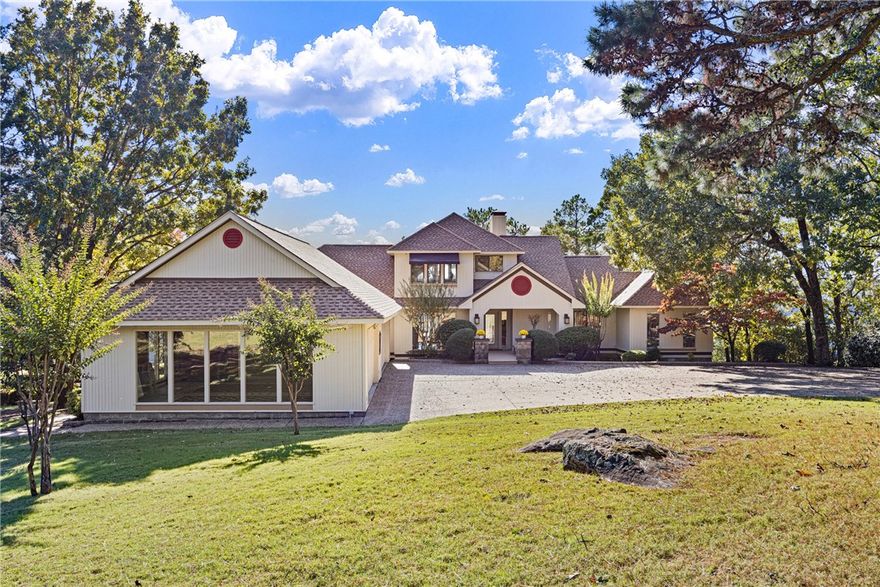 Here is your opportunity to own one of the best views in the River Valley.  This stunning, sophisticated home was built to maximize the magnificent views from the almost 2 acre bluff lot.  The Great Room, Kitchen, and Primary Suite all have large windows with expansive views looking out at the Arkansas River and Mt. Nebo.  This home has 2 bedrooms and two full baths on the main level, including the Primary.  Upstairs, you'll find a suite with a bedroom, sitting area, and another full bath, perfect for out of town guests.  The current owners are using this area as an office.  The oversized garage can easily accommodate 4 cars.  There is no shortage of outdoor areas to entertain and enjoy the views, with 3 decks, one of which is covered.  Marvel at the sunrises and sunsets.  Watch the barges traverse the river below.  Be at one with nature as bald eagles soar just outside your back door.  This is one of those rare gems that doesn't come along very often!