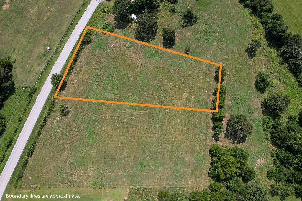Build your dream home! Check out this 1.98-acre ± lot in a fantastic location, just 10 minutes away from Springdale, 15 minutes from I-49, 9 minutes from a public ramp into Beaver Lake, and just 15 minutes from War Eagle Park & Marina. This lot can be sold with additional acreage and is part of an 6.53-acre parcel. No deed restrictions, out of city limits! Electric and public water are available at the street