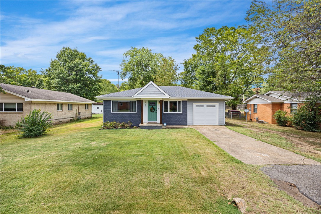 1902 S. Boulder Place in Russellville, AR, is a wonderfully remodeled 3-bedroom, 2-bath home with approximately 1,156 sq ft of charm and modern updates. The spacious primary suite features a large bathroom with a walk-in tile shower and convenient laundry access. Highlights include original wood floors, a tankless water heater, a fenced backyard, a 12x16 outbuilding, and a one-car garage. Since 2017, the home has seen extensive updates including roof, HVAC, flooring, cabinets, bath fixtures, lighting, and a garage conversion. Move-in ready and full of characterācome see for yourself!