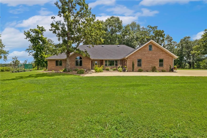 Rare find. If you're looking for a piece of Arkansas seclusion just minutes from downtown Bentonville, this is your place. This beautiful, all brick home sits on 14 acres and was completely remodeled in 2021 including new roof and gutters. See attached (or request) full list of all renovations. It comes complete with a Generac generator, 30x50 metal building to store all your toys. Bonus room is being used as an income producing Airbnb. Private driveway. Opportunity to subdivide. Also listed ML #: 1315023 and ML #: 1315018.
