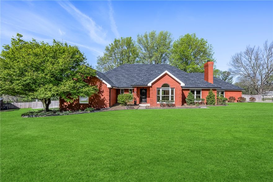 Opportunity awaits in one of Springdale’s most desirable subdivisions!  This hard-to-find, single-level home sits on a full acre and offers the space, layout, and features today’s buyers are looking for. The thoughtful floorplan includes two spacious living areas, a dedicated office or sunroom, a formal dining area, and split floorplan bedrooms for added privacy. The inviting den features built-ins, a wet bar, wood-burning fireplace, and beautiful wood floors—perfect for both everyday living and entertaining. The recently painted and updated interior offers 4 bedrooms and 2.5 bathrooms, blending comfort with modern touches. Step outside to a huge, privacy-fenced backyard complete with a partially covered wood deck—ideal for gatherings, relaxing evenings, or even adding a future pool. The surveillance system with six cameras and monitor will convey with the home.  A rare one-level property with this much space—inside and out—doesn’t come along often!