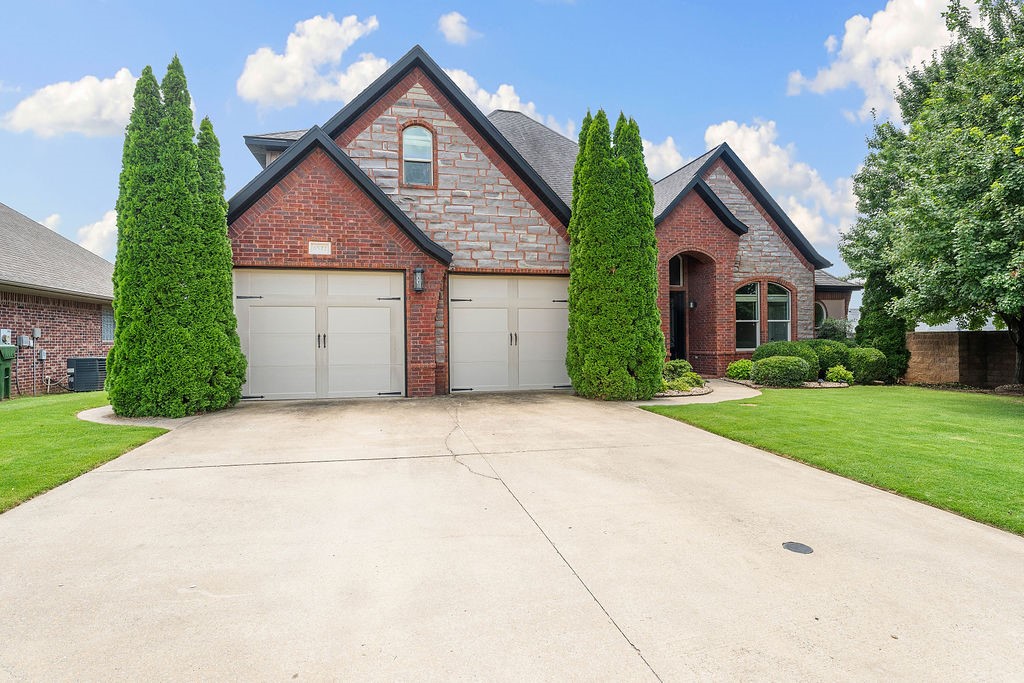 This is your opportunity to live in the coveted Hearthstone Neighborhood! Step into a home that combines style with comfort, featuring a striking living area with a centerpiece fireplace and serene views framed by a wall of windows. The open kitchen impresses with a generous granite island, bar seating, custom cabinetry, and added perks like a built-in wine rack and beverage cooler. Retreat to the primary bath that feels like a spa escape, with a deep soaking tub, double showerheads, and tasteful modern accents. The expansive covered deck offers multiple seating areas, an outdoor fireplace, and a pathway leading to nearby community amenities. The 4th bedroom would make a great office or nursery! Conveniently located just minutes from top-notch entertainment, retail, and dining, plus close proximity to Bentonville schools and local pool access. This is a property that truly has it all.