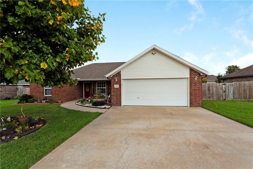 This 3 bed, 2 bath home is priced to sell in a great neighborhood centrally located in NWA!  The all brick exterior with architectural shingle roof keeps your maintenance on this home to a minimum.  A beautiful Tulip Poplar in the front yard provides wonderful afternoon shade for relaxing on the front porch surrounded by great landscaping.  The privacy fenced in back yard provides a nice oasis as well.  Inside the home you have great natural light and tall ceilings in the living room.  The split floorplan features 2 beds with a shared bath on one side and a master bed with large master bath featuring dual vanities and walk in closet on the other side of the home.  The garage has heat and air ductwork with a damper that can be shut off so that you can turn the garage into a workshop.  Call today to schedule a tour of this home before its gone!