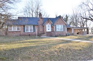 This home has a huge fenced in backyard and a nice view of Gaither Mountain. The house itself is a three-bedroom two bath with loads of charm. Other features include historic hard wood floors, gas fireplace that can be converted to wood, two HVAC systems, sun room, large den and heated/cooled bonus room in the attic. The house got new flooring this year, a new roof, a new dishwasher, trees trimmed, and some fence repair in 2022. In 2021 the sewer line was replaced, a new electric box and outlets rewired, the primary bath was updated and new window units for auxiliary AC plus much more. For history buffs, this home was once owned by Arkansas State Senator Ernest Nicholson. You'll be in walking distance to Harrison's largest park, city swimming pool and future Creekside Rec Plex.