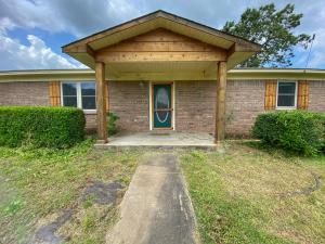 3 possibly 4 bedroom home on 4+ acres minutes from Petit Jean Mountain! Brand new roof, AC unit, flooring and all new windows!