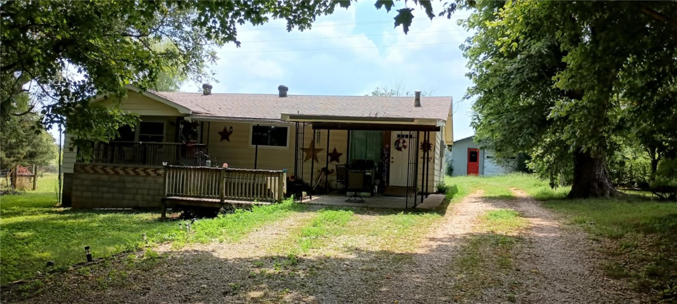 VERY NICE WELL MAINTAINED HOME ON HALF AN ACRE! HOME IS NESTLED AMONG MATURE TREES. LARGE KITCHEN, LOTS OF CABINETS AND STORAGE, WALK IN UTILITY ROOM! FENCED IN BACK YARD, SHOP, OUTBUILDING AND STORM CELLAR