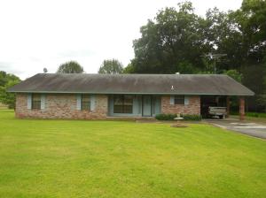 MINI FARM....Nice house setting on 3.43 acres on a major highway. Large open living and dining areas, large kitchen with lots of cabinet space, breakfast bar, large laundry room, attic fan, ceiling fans and more. Large detached workshop with concrete floor, small horse barn and storage building with carport. A perfect spot for your mini-farm. You must see this one today.