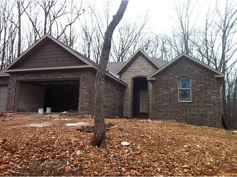Bentonville Schools! Practical floor plan located convenient to CR-40 & Hwy 49, Flat back yard! featuring 4 br's,3 car garage, stainless, whirlpool tub, granite, under mount sink, gas FP, all the upgrades.,Oil rubbed bronze, Custom Cabs, Low-E windows, Tumbled Marble, Hand-scraped wood floors, 10ft ceilings in common areas, energy efficient heat, exterior up-lights. Very hard to find SEWER, Bentonville Schools, Close to 49 ! Come pick your own Colors.