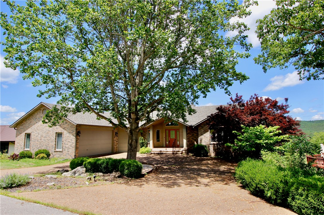 Welcome to your dream home in the heart of the Ozarks! Nestled on the lush fairways of Holiday Island’s premier golf course and just 2 minutes from Table Rock Lake and marina access, this beautifully maintained 4 br,4.5 ba home offers the perfect blend of comfort, space, and scenic charm. With nearly 3,900 square feet of living space. This home features multi-level decks ideal for entertaining or simply enjoying panoramic views of the course and surrounding nature. Inside, you’ll find spacious bedrooms, multiple living areas large decks, and a layout perfect for families or hosting guests. Direct golf course frontage. Enjoy close proximity to golf, swimming, hiking trails, local shopping, and all the natural beauty Holiday Island has to offer. Whether you're seeking a full-time residence, a vacation retreat, or an investment opportunity, this home checks all the boxes. Don’t miss your chance to own this gem in one of Arkansas’s best-kept secrets!
