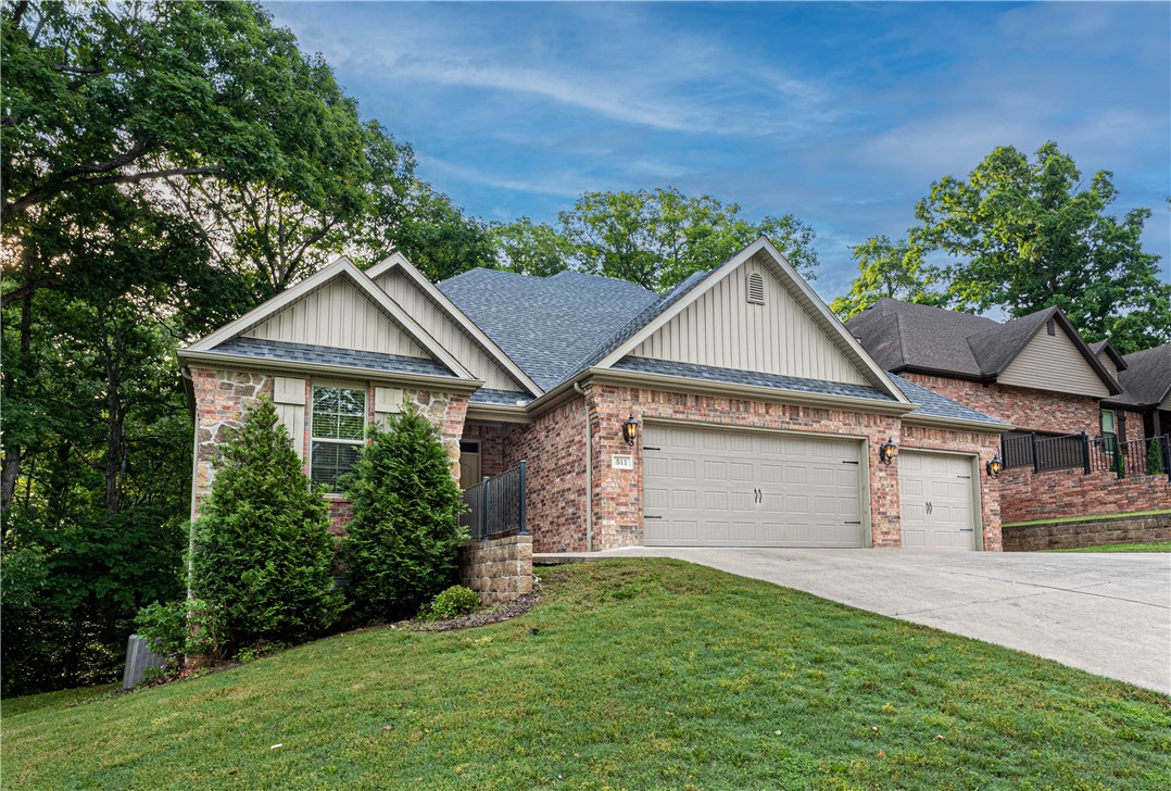 Introducing this beautifully maintained home nestled in the heart of Bentonville. This spacious 4-bedroom, 3-bathroom, bonus room with walk-in closet, house features an open floor plan perfect for entertaining guests and family. A luxurious kitchen complete with granite countertops, and stainless-steel appliances and Nest thermostat await you. The living room is bright and airy with natural light that flows through the large windows. Each bedroom has plenty of closet space and the master bedroom has a private ensuite with a soaking tub and walk-in shower. Stunning wood floors and a cozy fireplace complete the warm and inviting atmosphere throughout the home. Enjoy the outdoor living space complete with a covered patio. Conveniently located to Walmart Home Office, Coler biking trails and just a short drive to downtown Bentonville. Make 511 SW Sims your new home today!