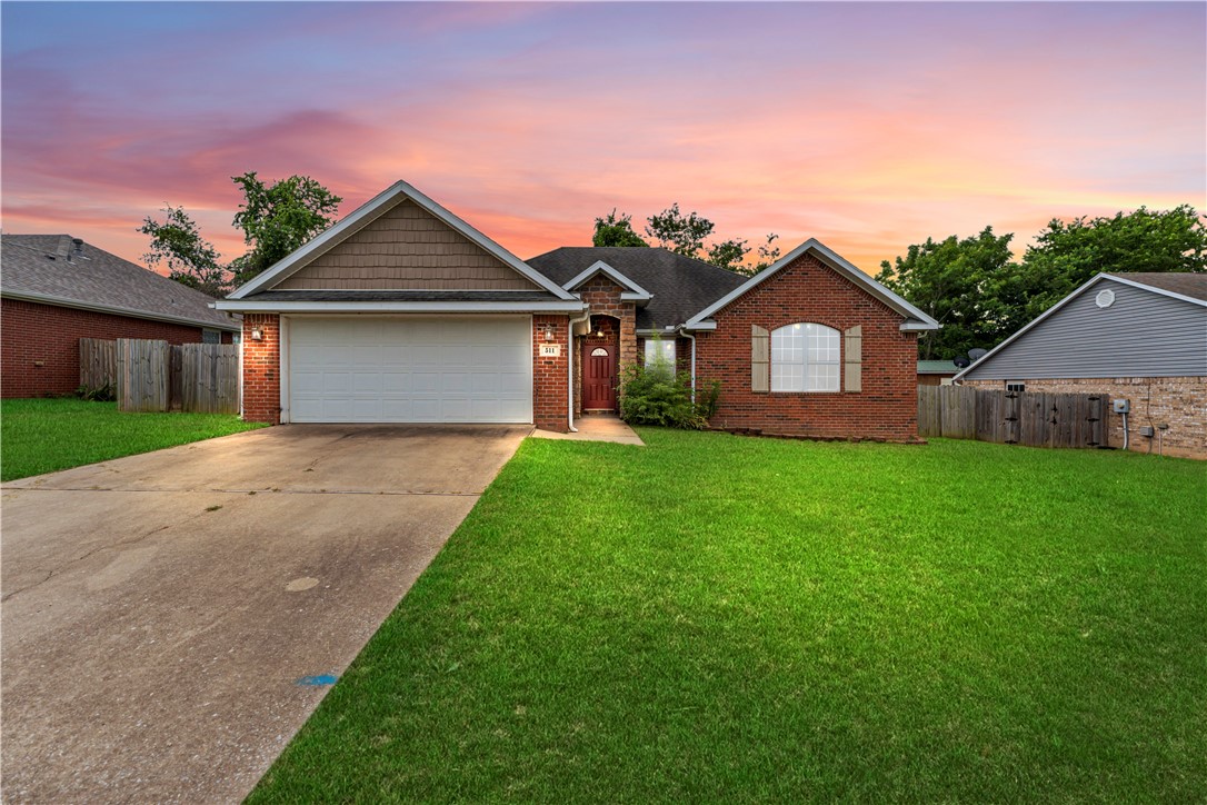Well cared for home in quiet neighborhood with fenced yard! Spacious kitchen and Gallery Fridge included! Large bedrooms. High ceilings. Natural light. Short drive to Fayetteville and downtown West Fork!
