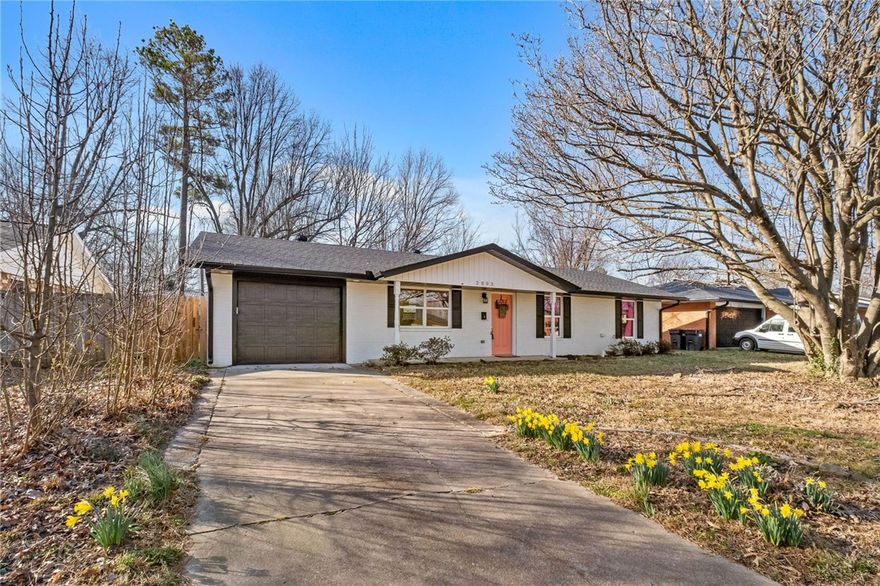 Nestled in the heart of NWA, this charming home offers a blend of comfort, convenience, and character.  The home was completely remodeled in 2022 for low-maintenance living and energy efficiency with excellent insulation. Cozy, welcoming living spaces feature recessed lighting and a comfortable flow ideal for everyday living or entertaining. The spacious kitchen offers generous counter space and abundant storage  Bright bathrooms include large mirrors, expansive counters, and easy maneuverability. New roof in 2022 + whirlpool tube + electric fireplace insert + a gorgeous early spring blooming large Tulip tree. Ideally located just minutes from the highway and vibrant downtown Springdale, you’re near to everything that makes this area special- the Springdale Public Library and downtown Springdale — home to local restaurants, coffee shops, parks, nightlife, art, and year-round community events.