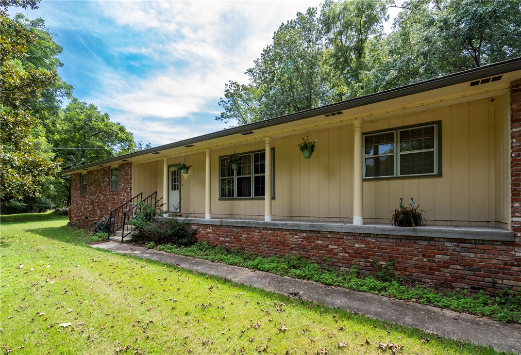 Nestled on nearly six acres just outside of Rogers, this charming brick home offers the perfect blend of peaceful country living and city convenience. Located in the sought-after Little Flock area, the property provides privacy, space, and endless opportunities. Inside, youāll find unique character throughoutāfrom graceful archways to a cozy brick fireplace that anchors the living room. Abundant natural light fills the home, creating a warm and inviting atmosphere. The spacious layout offers comfort and flexibility, ready for your personal touch. Step outside to enjoy open land bordered by mature trees and even a fruit treeāideal for a hobby farm, outdoor activities, or simply enjoying the quiet, scenic surroundings. Despite its secluded feel, youāre just minutes from downtown Rogers.