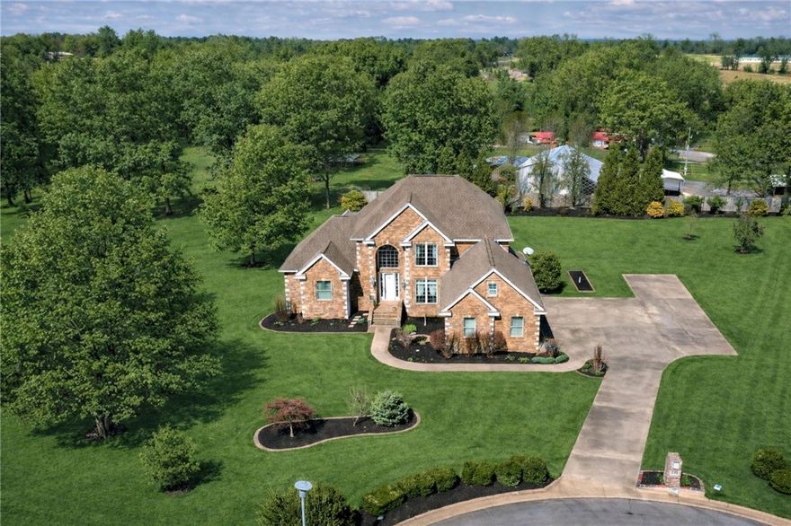 Fantastic West Fayetteville home situated on 2.0 manicured acres in a quiet cul-de-sac. This 5,110 heated square foot property offers 5 bedrooms, 3.5 baths, and multiple living spaces designed for comfort and flexibility.Main level features include an open kitchen flowing into the living area, formal dining room, and spacious primary suite. The finished basement provides additional living space with a second living room, wet bar, pool table/game room, safe room, and abundant storage throughout the home. The 2nd level contains a landing area, bonus room, and 2br/2ba. Additional features include: : 3-car side-entry garage,3 outdoor patios, 2 fireplaces, central vacuum system, security system, and a Marathon hot water heater with recirculator Beautifully maintained acreage offers privacy while remaining convenient to Fayetteville amenities.