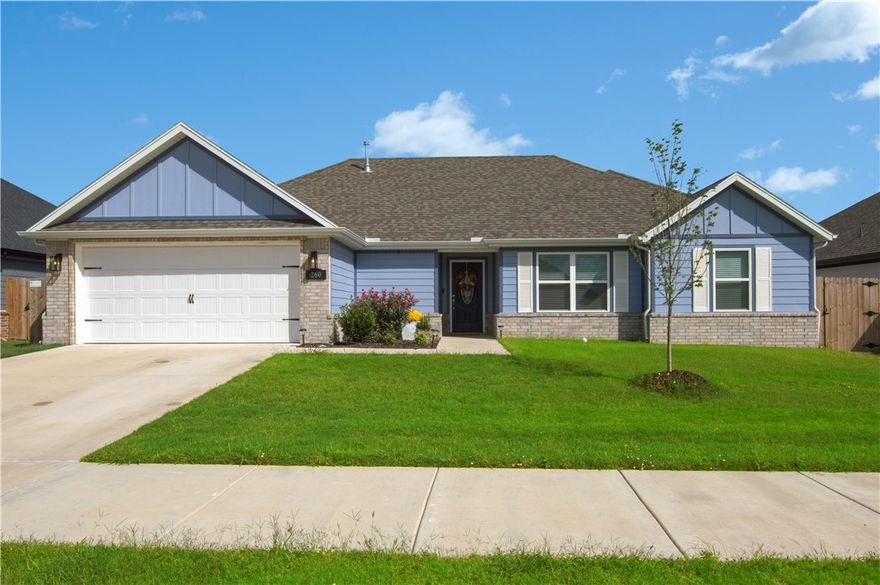 Limited time opportunity - $5000 closing cost assistance with approved offer. Beautiful 4-bed, 2-bath Craftsman home in The Element, West Fayetteville! Just one year old, this move-in ready home features an extremely open floor plan with glazed porcelain wood look floor tile flooring, cathedral ceilings, granite countertops, and stainless steel appliances. The spacious living room offers a cozy gas fireplace, while the kitchen boasts a large eat-in area and granite countertops. Primary suite includes a tub, soaking tub  walk-in shower, and generous closet space. Recent upgrades include French drains, EV charging in the garage, and a new storage building. Enjoy the large fenced backyard with covered patio—perfect for entertaining. Located near schools, parks, shopping, and playgrounds in a quiet, professionally landscaped neighborhood. One-level living, 2-car garage, gas heat, and modern finishes throughout make this an exceptional property