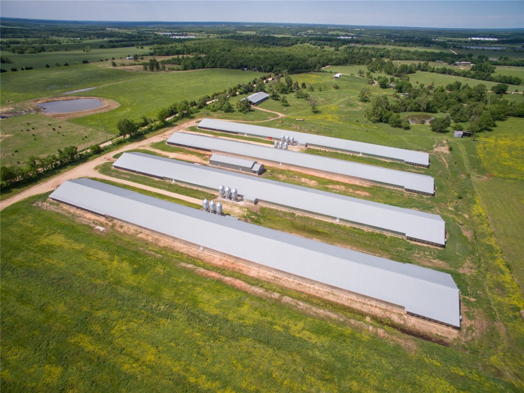 The demand is strong for recently built contract farms like this! The companies aren't building any more for a few more years. Now's a good time to look at this one. 4 66x600's with a Simmons contract at 6.55 guaranteed pay until early 2021. Natural gas and public water backup save money and trouble. 40x140 well house with 40k storage and a 40x150 stacking shed on 60 acres with room to expand add value. Over $450k gross last year!