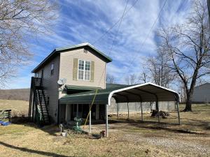 House on 1 plus acres. 4 Bed, 1 Bath with Oak wood floors downstairs. This would make a great investment property. With a little TLC, can flip or would make a nice rental. Pretty views off back porch. Priced to sell. Nice shop building. Property being sold as is