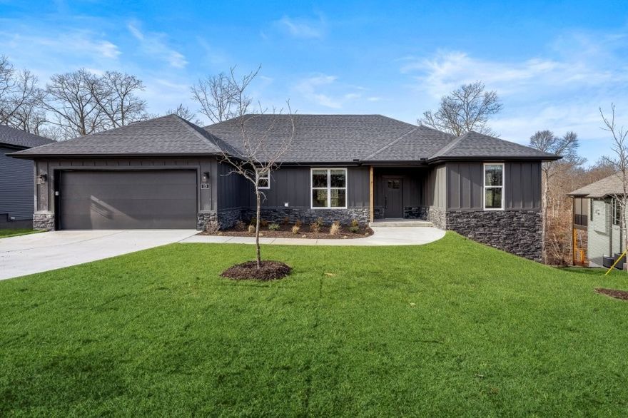 Beautiful new construction home just minutes from Loch Lomond, Highlands Golf Course, & quick access to I 549. This modern, thoughtfully designed home offers an open layout filled w/natural light & peaceful wooded views. The spacious living area flows seamlessly into the dining space & bright kitchen, featuring custom soft close white cabinets, stainless steel appliances, pendant lighting, pantry & large island perfect for gathering. LVP Wide plank flooring adds warmth & style throughout main living spaces. The luxurious primary suite includes a beautiful custom tiled walk-in shower with frameless glass, dual vanities, matte black fixtures, & a connected walk-in closet for everyday convenience. Step outside to an inviting back deck, ideal for relaxing or entertaining. With quality finishes including blinds & gutters, functional design, & a prime Bella Vista location near lakes, golf, trails, & commuter routes, this home delivers comfort, convenience, & elevated living. 100% financing ($0 down payment) available!