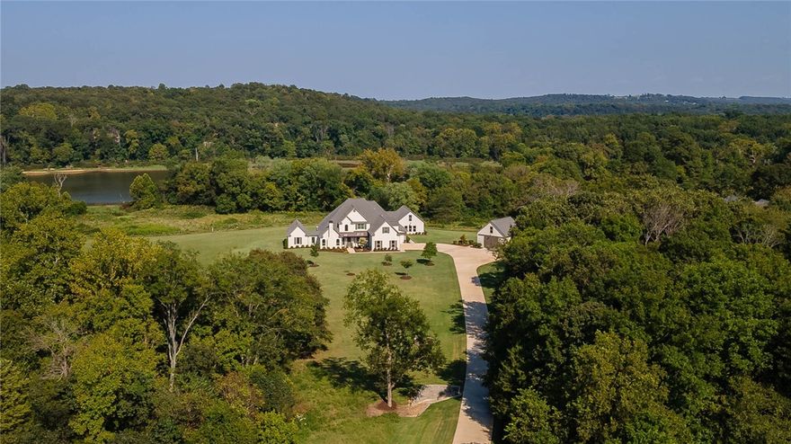 Amazing ESTATE style home situated on 6.05 manicured acres that abuts the WHITE RIVER at the end of a private gated street! The MAIN house offers 5,205 sq ft, 4 bedrooms, 3.5 full bathrooms, open eat in kitchen, formal dining, study, bonus room, separate laundry, TWO primary closets and a home gym. The GUEST house has 750 sq ft which includes 1 bedroom, 1 full bath, a living and kitchenette. Amenities include an inground heated saltwater POOL, whole house generator, SPORTS COURT, outdoor living with built-in grill/refrigerator/radiant heating, Sonos surround sound inside and out, commercial grade epoxy floors, dog wash, and MORE. Home was built in 2019 and then partially remodeled in 2022. Don’t miss the 25 x 30’ DEATCHED garage. This property is truly REMARKABLE!!