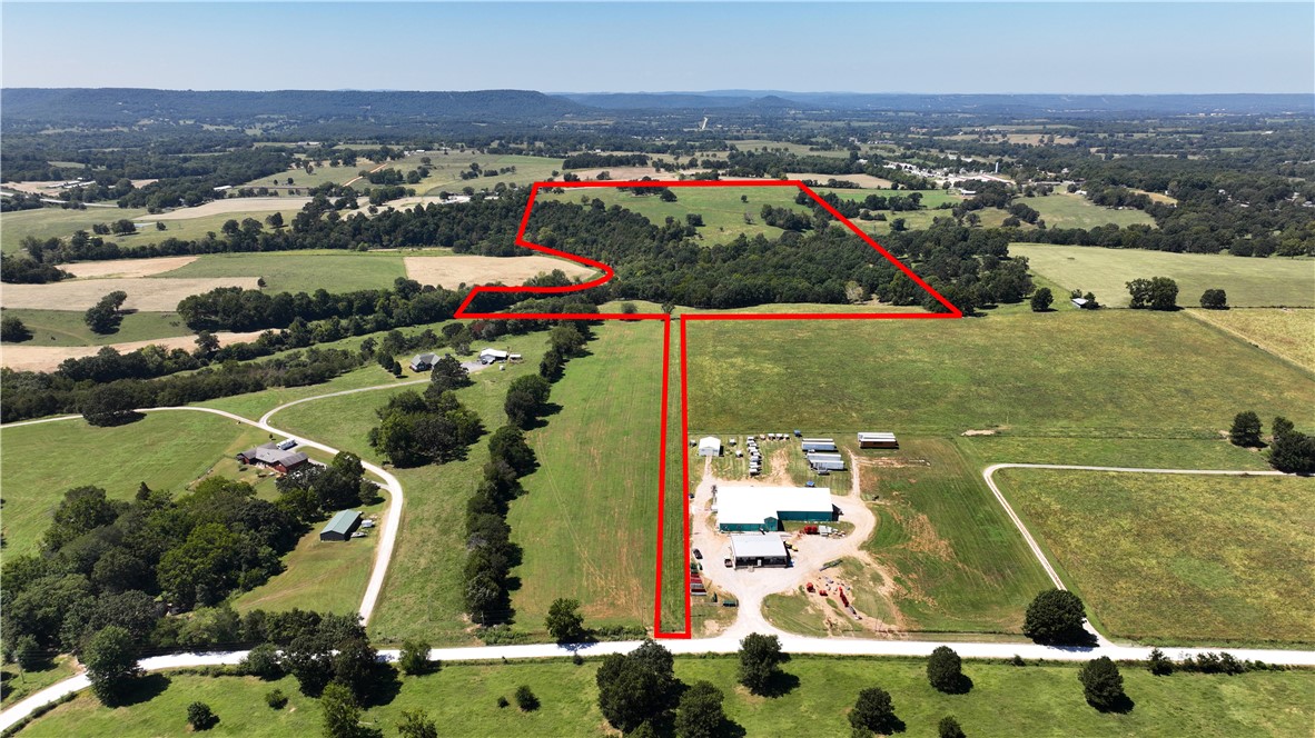 This property has it all! 1/2 mile of Osage creek frontage more or less. It also has several springs throughout. Beautiful Views and multiple building sights. Opportunity to have a ranch within a quarter of a mile from city limits of Berryville. Or you can survey it off to make a couple of ranchettes. Lots of grazing grass for cattle. A set of working pens and cattle watering stations. Fronts 2 paved roads, both Highway 21S and CR 702. This property has been in rotation grazing program for over 20 years. Here is your opportunity to build your dream home on an awesome property in the Ozarks.