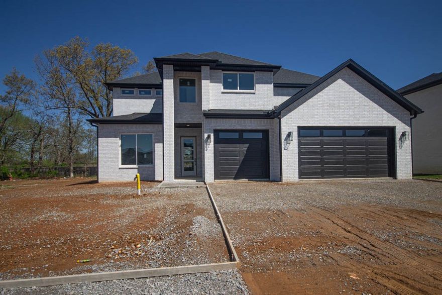 New construction modern home with gorgeous exterior in sought after gated community of Scissortail. Enjoy the stunning living room with custom beams, tiled linear fireplace, tons of light streaming through ample amount of windows and open floorplan. Kitchen features large island, stainless steel appliances, gas range, quartz countertops, double ovens, walk in pantry and storage! Home also features 5th bedroom on the main level that could also work as a study. Spacious, private master bedroom with luxurious master bathroom. Master bath with double sinks, storage, walk-in tile shower and soaking tub. Upstairs features three large bedrooms and large bonus room with wet bar. Huge covered patio with landscaping perfect for entertaining!