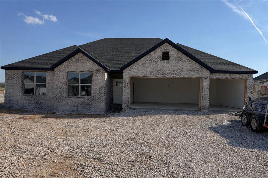 Experience the Lucy plan at Spring Creek Farms. This modern community will feature a community pool, playground and walking trails. The Lucy Plan offers refined single-level living with a thoughtfully designed 4-bedroom, 2.5-bath layout that blends comfort and sophistication. The open-concept design is enhanced by soaring vaulted ceilings accented with beams, and gas log fireplace. The kitchen is beautifully appointed with custom soft-close cabinetry extending to the ceiling, a gas range, fully vented hood, and built-in microwave—perfectly balancing style and functionality. The primary suite is a serene private retreat, featuring a a tray ceiling in the bedroom and a luxurious walk-in shower and soaker tub for a true spa-like escape. A 3-car garage and a large covered patio with gas and ethernet hookups complete this thoughtfully crafted luxury design.