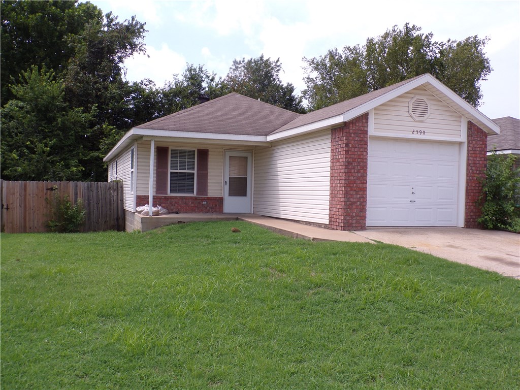 Clean and ready to move into 3 bed 2 bath with tile and vinyl plank flooring, one car garage, fenced backyard just off 71B. No smoking, pets negotiable.