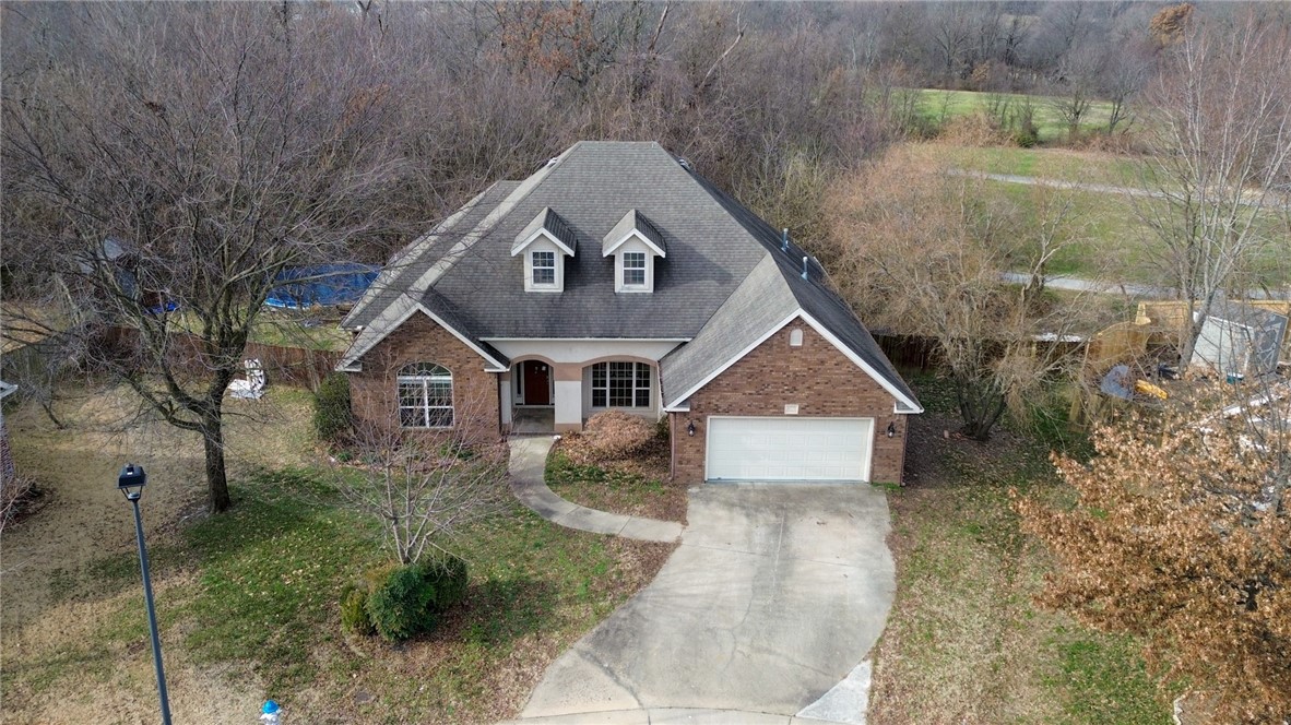 Wow what an opportunity for a family that wants walking access to trails, a disc golf course and playgrounds with picnic pavilions, ball fields and more 100 feet away. A Lake Springdale is very close as well, see aerial photos. This home needs some new flooring and minor repairs and is priced for you to own a great home in a lovely neighborhood for a lot less than comparable houses. Easy access to Highway 71 and I-49. Only 20 minutes to Fayetteville or Rogers or Bentonville.