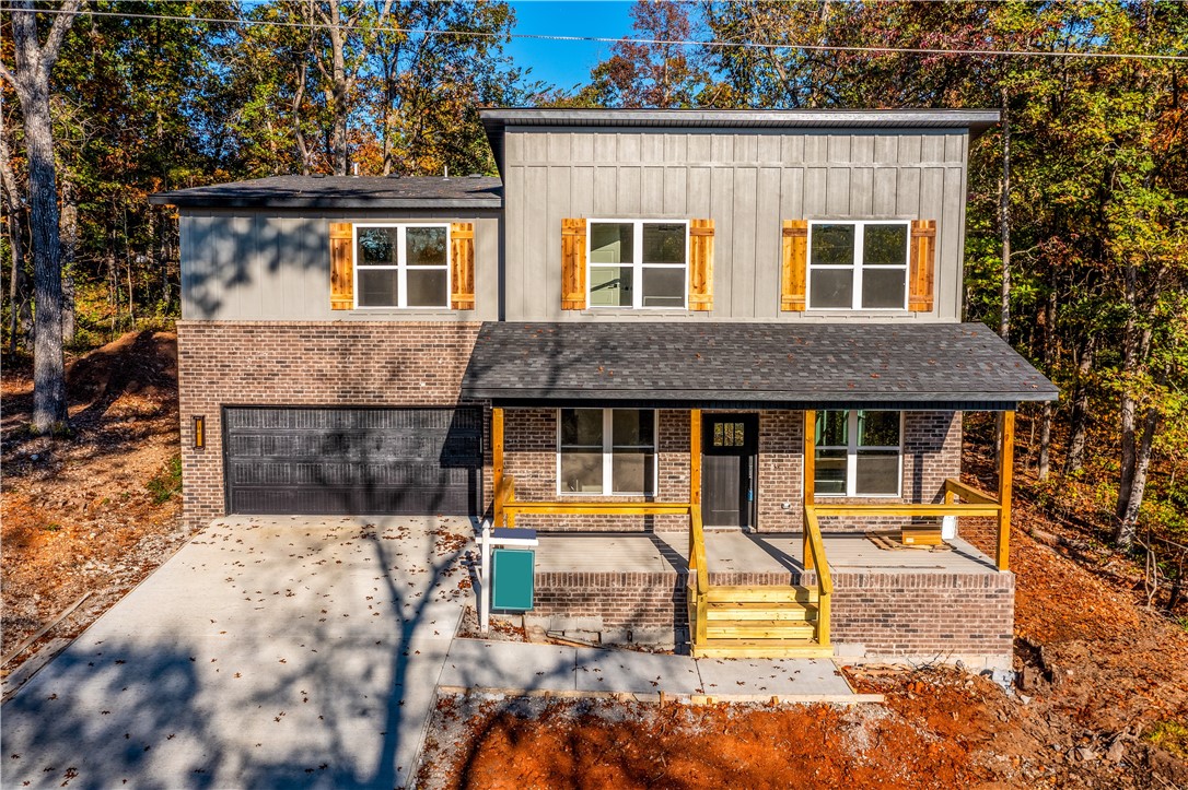 Get ready for this one - walk out your front door to hop on the Back 40 Trail. The Perfect Airbnb property or long-term residence with the easiest access to all the trails, golf, greenway, Bentonville Academies, and Bella Vista offerings. 3 bedroom 2.5 bath. With custom cabinets, quartz counters, a pantry, an electric fireplace, engineered hardwood floors, beautiful tile showers, Pella Windows, walk-in closets, a covered front porch & back deck, with energy-efficient appliances, this house is the complete desired package. The house is estimated to be completed by 11/15āseller to offer $5,000 in concessions or closing costs.