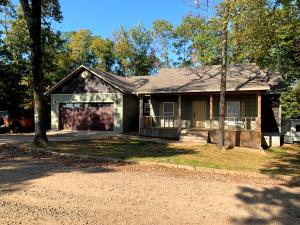 Looking for a great home with a beautiful view? This house is perfect for you! Sitting on approximately 2.2 acres off the highway, this country home features an almost 1,000sf heated & cooled downstairs shop with garage door access on both sides, a beautiful outdoor deck, and a nice big pond for fishing. The inside of this home was designed with an open floor plan that is great for entertaining!