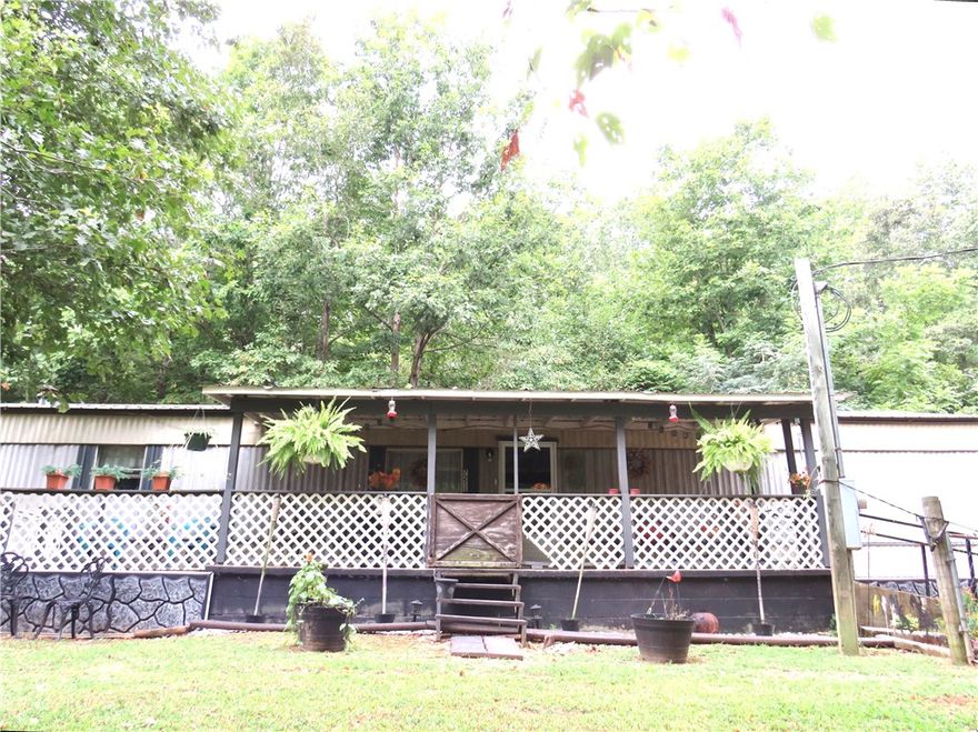 Enjoy quiet living with a fully fenced front and back yard, perfect for pets or entertaining. The property includes a 2-car garage with shop space, a storage building with electricity and water, and a pool with a surrounding deck.
A fully paved driveway adds convenience, while the spacious layout and outdoor amenities create a relaxing, private environment. Whether hosting guests, enjoying the pool, or simply unwinding in the peaceful surroundings, this home offers comfort and functionality. 
Home is being sold As Is – a great opportunity for the right buyer!