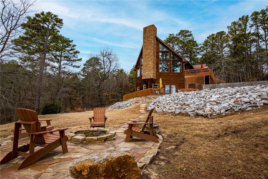 Wow, Colorado cabin style home on Beaver Lake w/ boat slip & lift! Located on Ventris Cove, just minutes to Prairie Creek Marina. Exterior amenities include 2 car drive through garage, 3 patios & decks, Flagstone Firepit, & Hot Tub w/ lake views. Easy walk to 3 slip boat dock w/ swim platform. 1 slip dock w/ lift & personal locker. Great floor plan w/ Master bedroom on main level; 3 beds, 2 full baths, & family room in walk-out basement: Game room loft. Large bedroom in basement can be 2nd master. Heated floors in both basement bathrooms. Motorized blinds in LR (middle level). Programmable Nest thermostat & front door lock. Home comes fully furnished! Airbnb & VRBO history upon request. See or request 3D tour link.