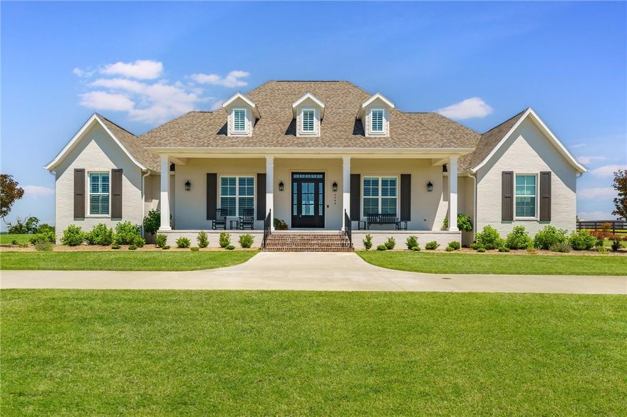 This custom home exudes timeless elegance sits on 4.99 acres & pond in east Fayetteville. Circle drive leads to large front porch, perfect for sunset views. Open floor plan features a living room that flows into the kitchen w/a large natural quartz island.  Kitchen boasts extensive cabinetry, under-counter lighting,Fisher  & Paykel appliances, 6-burner gas range, dbl ovens, microwave, dual dishwasher, & sub-zero refrigerator. Walk-in pantry has built-in desk area. Living room features a beamed ceiling, gas fireplace, and built-ins, opening to the spacious back porch with a fireplace, TV, gas grill, and ceiling fan. The media room offers theater seating, a 128" screen, surround sound, & top-of-the-line equipment.
This home has 4 bedrooms, each w/ private bath. Upstairs includes large game room/bedroom w/ full bath & dbl vanities, + office w/skylight. Primary suite has radiant heated floors, his/her closets, one is safe room w/surveillance equipment. Heated & cooled garage & workshop feature epoxy flooring.  
.