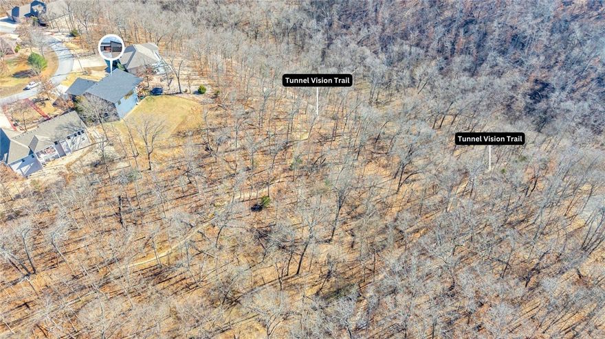 Trailside living meets modern comfort in this recently built 3-bedroom, 2-bath home featuring an open-concept, split floor plan with direct access to the Tunnel Vision Mountain Biking Trail.  Enjoy sunset views from the porch and abundant natural light throughout. The kitchen, with quartz countertops, opens to the main living area with real hardwood floors, new fireplace, and Pella windows and doors. Bedrooms offer oversized walk-in closets, and a spacious laundry room adds everyday convenience. The garage includes epoxy floors for a clean, functional finish. Energy-efficient with premium insulation and low-maintenance HardieBacker siding. Located just 2 minutes from Scottsdale Golf Course, 5 minutes from Avalon swim beach, and approximately 15 minutes from the upcoming OZTrails Bike Park, this home blends modern comfort with an outdoor lifestyle.