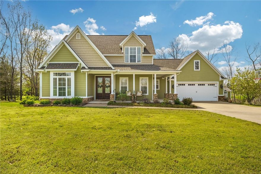 Nestled on a spacious one-acre lot, this stunning 4-bed, 3-bath craftsman-style home is bursting with charm and character. Thoughtfully designed and beautifully maintained, it offers the ideal blend of comfort and style. Located minutes from top restaurants, vibrant entertainment, Rogers schools, and Beaver Lake, this home offers the perfect balance of peaceful living and city convenience.

- 4 bedrooms, 3 full bathrooms, dining room, office, & 2-car garage.
- Backyard oasis perfect for entertaining. Features include a covered deck, patio with fire pit, and access to a pond.
- Additional 200 sf storage building with matching exterior.
- Rogers School District.
- Minutes from Walmart's new Home Office, Downtown Bentonville, Downtown Rogers, Pinnacle Hills Promenade, & the Walmart AMP.