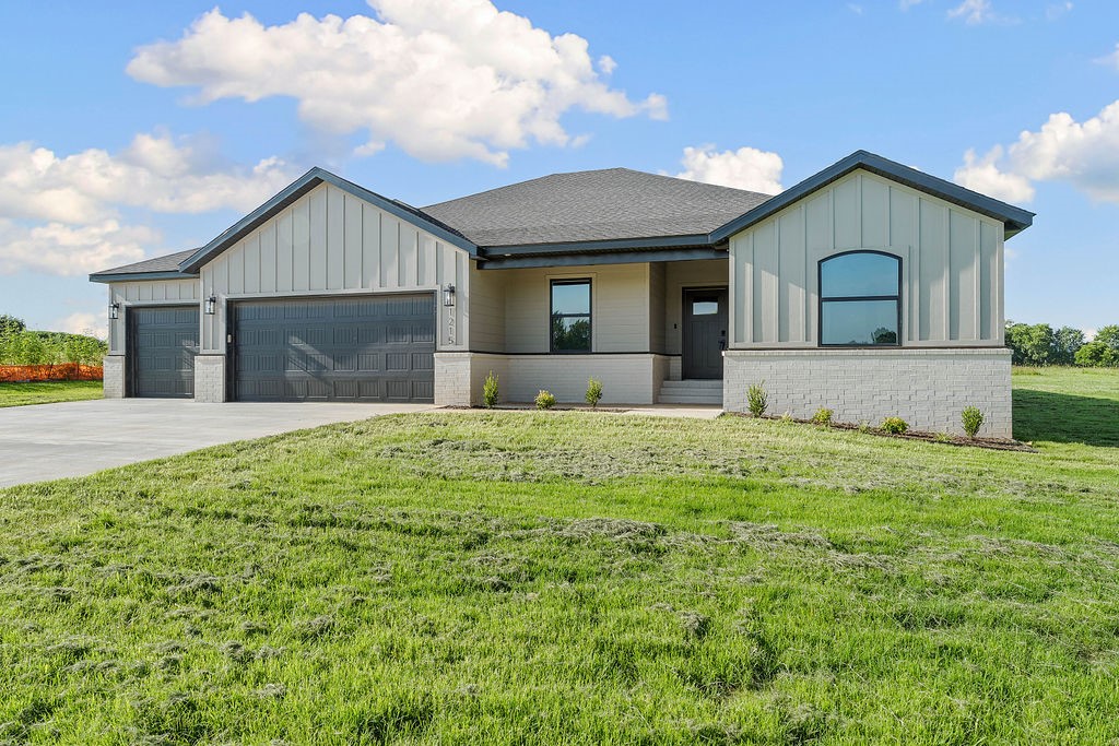 Modern Elegance Meets Country Living – New Construction on 1 Acre Lot. Step into refined luxury with this brand-new, single-level home on a full acre. Designed for comfort, style, and function, this thoughtfully crafted home features 4 spacious bedrooms, game room, and 3-car garage. Inside, you'll find custom cabinets, detailed trim, and designer finishes throughout. The living area is filled with natural light, complemented by sleek LVP flooring and a modern feature wall. Kitchen has quartz countertops, large island, and a walk-in pantry. Retreat to the spa-like primary bathroom with a freestanding tub, dual vanity, and striking tile accents. Every room showcases craftsmanship, from the game room to the functional utility spaces. Set on level lot, there's room to breathe, entertain, or add a shop. A newly paved road is underway with completion of new subdivision planned to the east—bringing value and community to your doorstep. Convenient location, minutes from downtown Bentonville. Check photos for concessions.