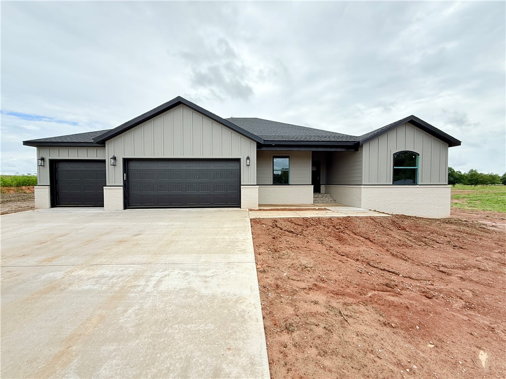 Modern Elegance Meets Country Living – New Construction on 1 Acre Lot. Step into refined luxury with this brand-new, single-level home on a full acre. Designed for comfort, style, and function, this thoughtfully crafted home features 4 spacious bedrooms, game room, and 3-car garage. Inside, you'll find custom cabinets, detailed trim, and designer finishes throughout. The living area is filled with natural light, complemented by sleek LVP flooring and a modern feature wall. Kitchen has quartz countertops, large island, and a walk-in pantry. Retreat to the spa-like primary bathroom with a freestanding tub, dual vanity, and striking tile accents. Every room showcases craftsmanship, from the game room to the functional utility spaces. Set on level lot, there's room to breathe, entertain, or add a shop. A newly paved road is underway with completion of new subdivision planned to the east—bringing value and community to your doorstep. Convenient location, minutes from downtown Bentonville. Check photos for concessions.